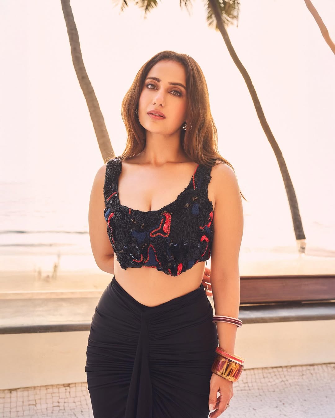 Kusha Kapila in the Noir draped skirt