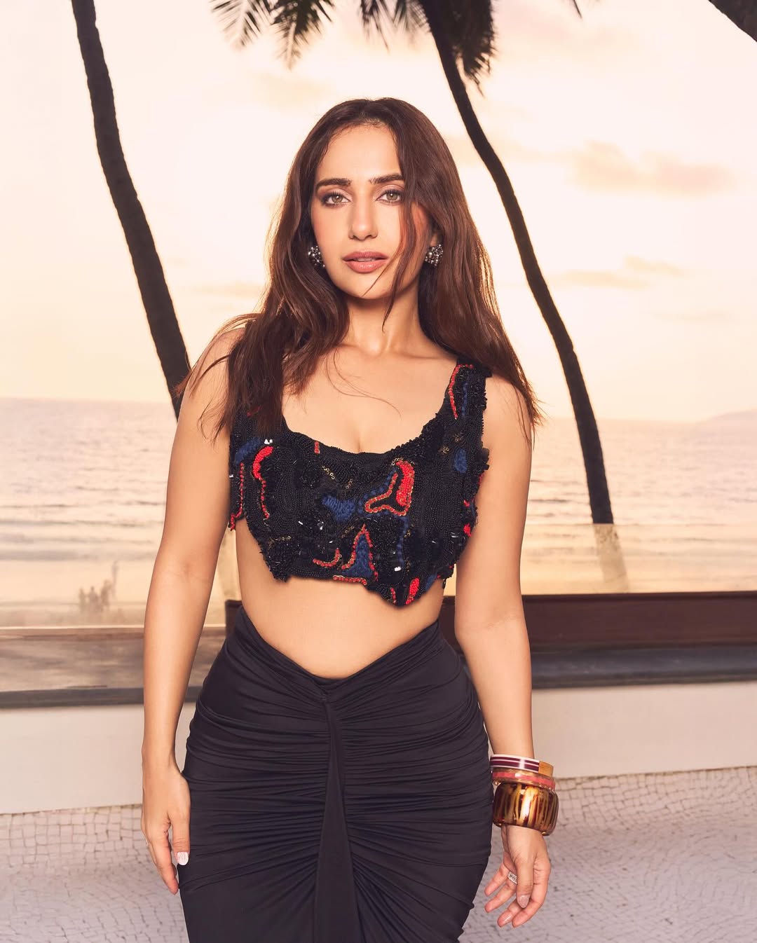 Kusha Kapila in the Noir draped skirt