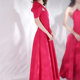 One shoulder strap with draped sleeves